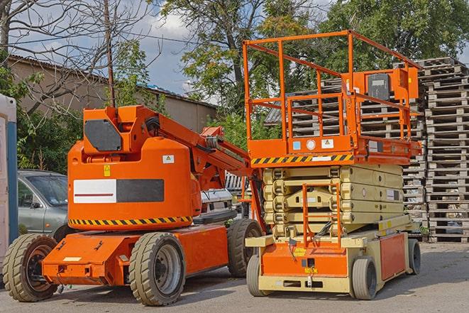 warehouse forklift in action during a busy workday in Manville, RI